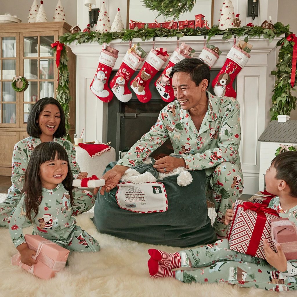 Family wearing matching mint Candy Cane Village Christmas pajamas